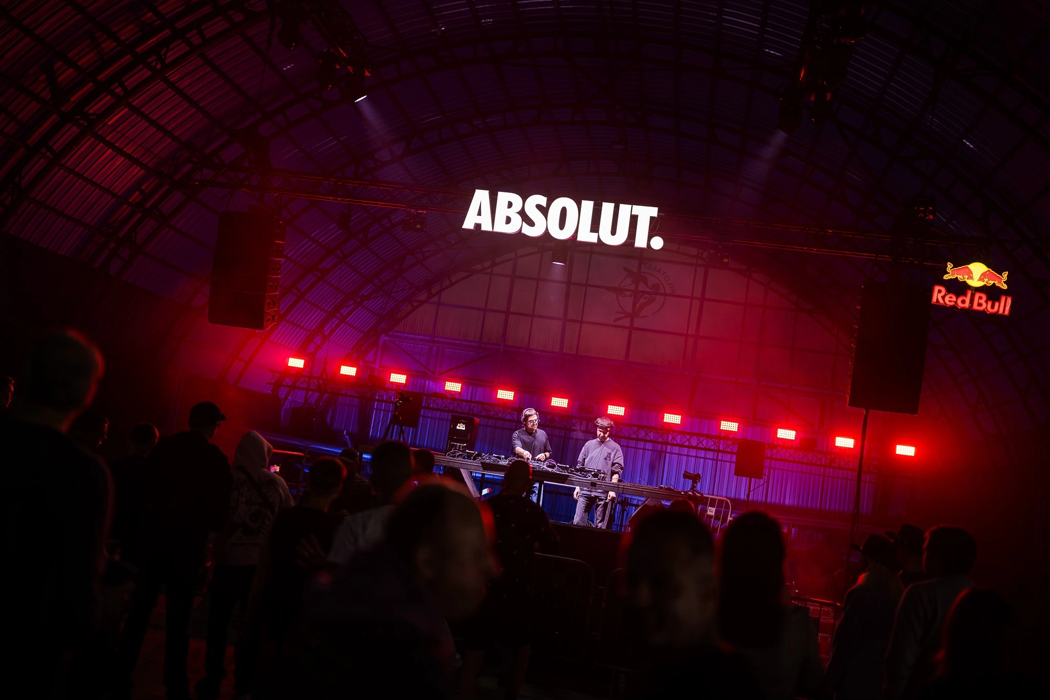 The stage glowing red inside the airplane hangar